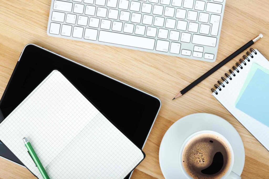 Office supplies, gadgets and coffee cup